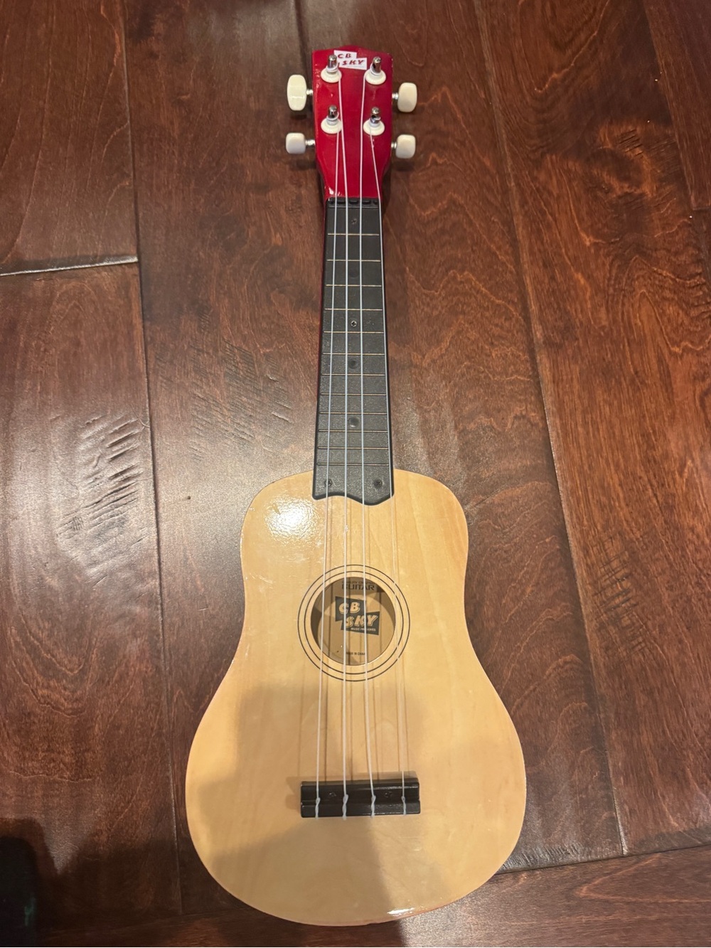 CB SKY 21-Inch Soprano Ukulele with a natural wood body